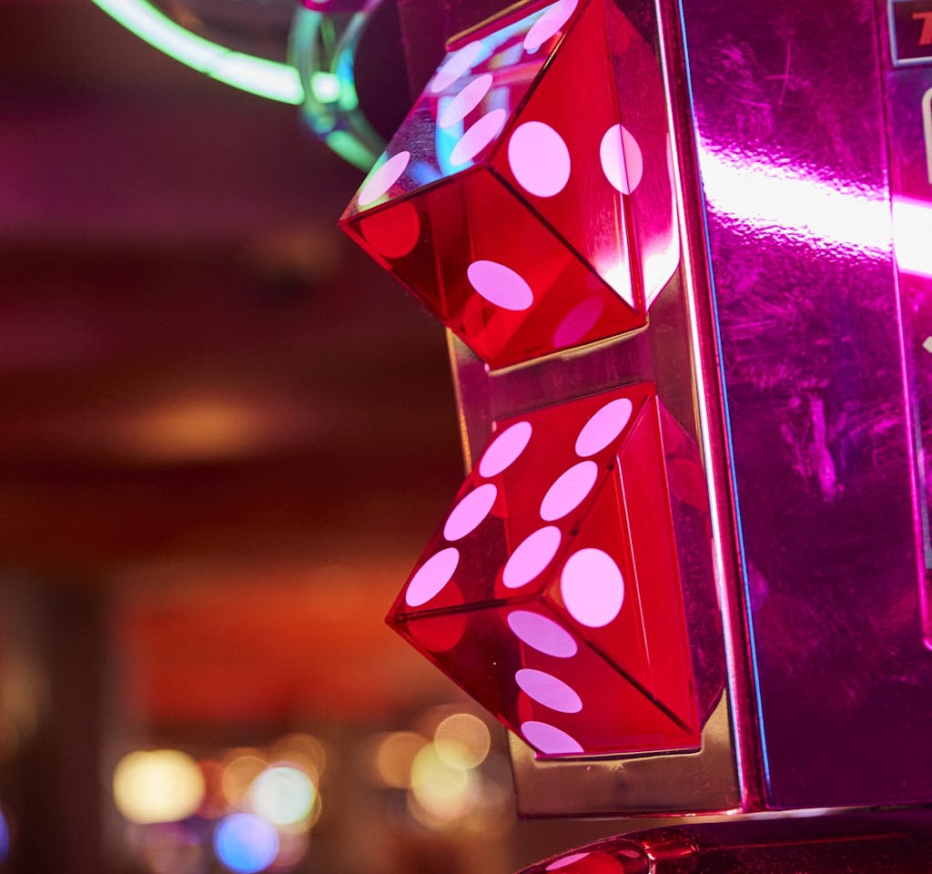 Colorful decorative casino dice on side of slot machine