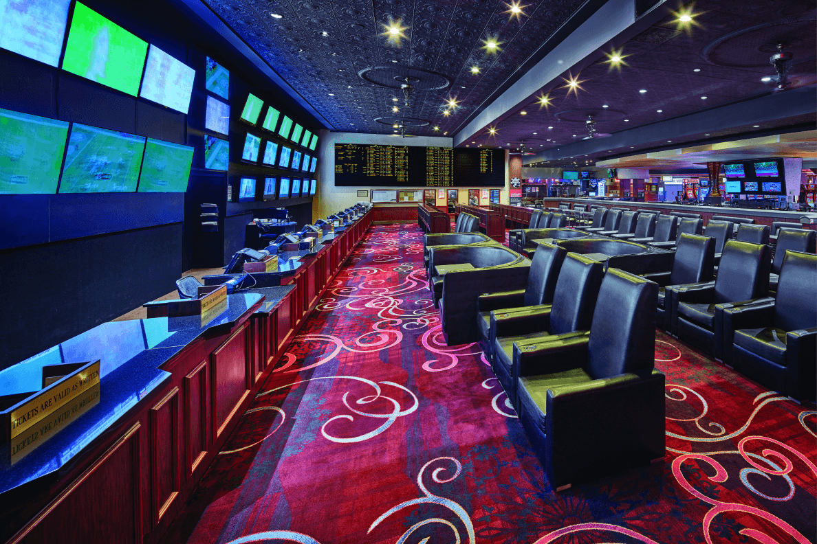 William Hill Sportsbook at Rio Hotel & Casino with numerous TV screens and leather chairs