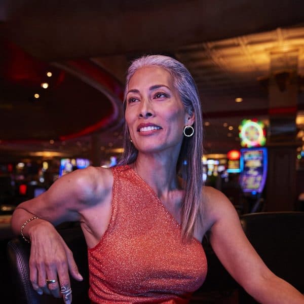 Woman sitting and enjoying time in the casino in Las Vegas