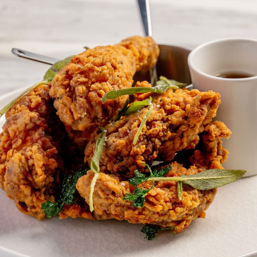 Smoked fried chicken from High Steaks Vegas, a modern steakhouse set to debut in October 2025 atop the Masquerade Tower of the Rio near the Las Vegas Strip.
