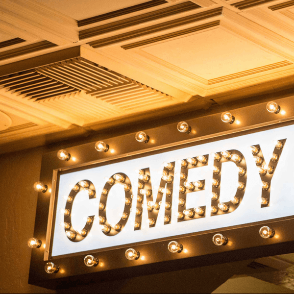 COMEDY CELLAR lit sign with bulbs