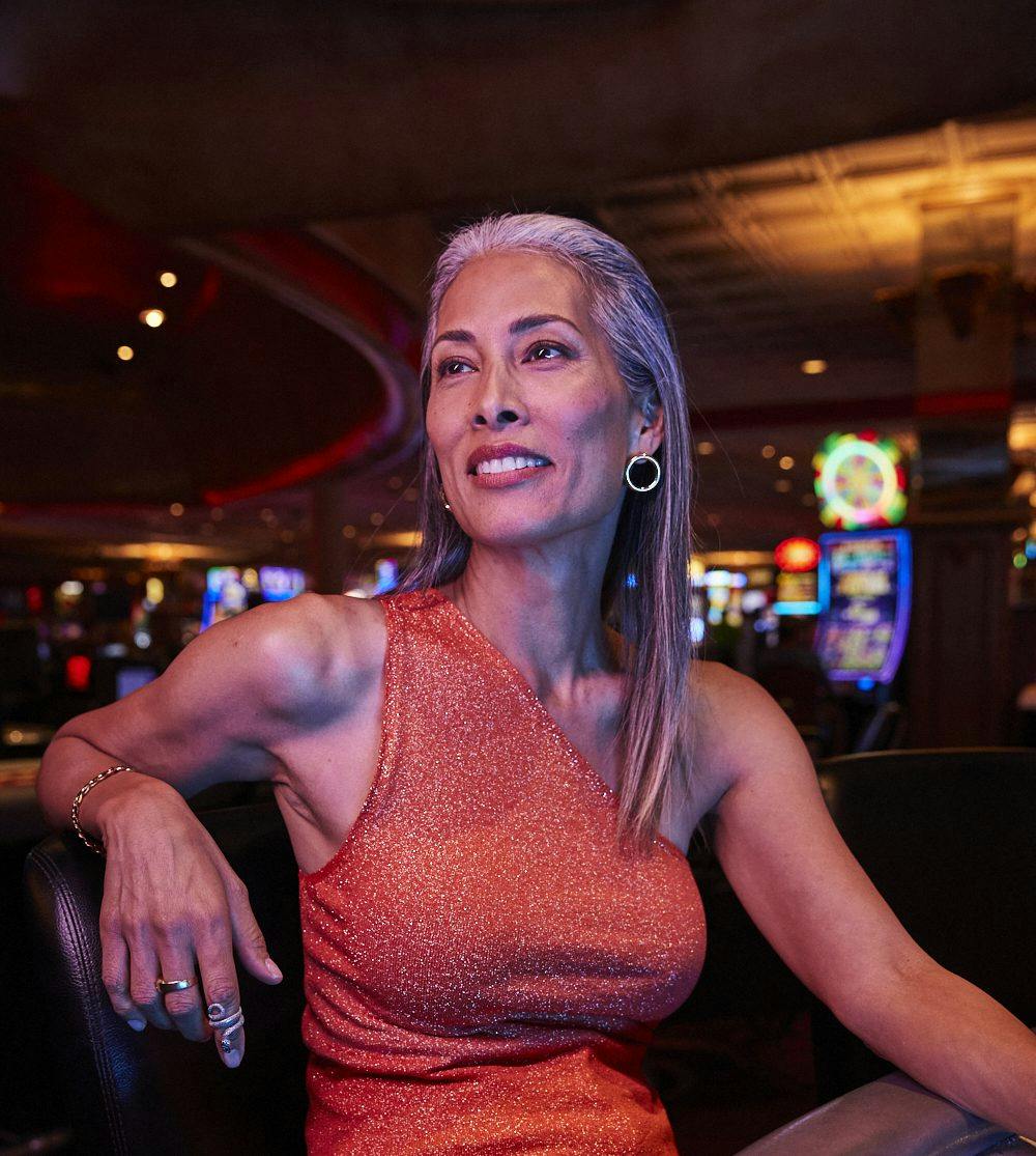 Woman sitting and enjoying time in the casino in Las Vegas